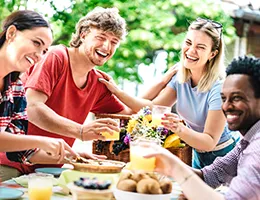 group of young adults enjoying a meal together